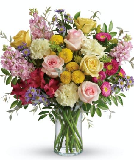 This beautiful bouquet includes red alstroemeria, light yellow carnations, pink stock, hot pink matsumoto asters, large lavender monte cassino asters, yellow button spray chrysanthemums, bupleurum, huckleberry, and parvifolia eucalyptus. Delivered in a clear cylinder vase. Approximately 16 1/2" W x 17" H