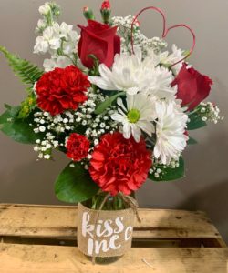 Designed in a mason jar (sayings may vary), this Valentine arrangement is sure to please. Match this with an added Valentine balloon or chocolates and you have the perfect Valentine gift.