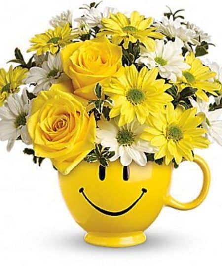 Cheer someone up—or just share a happy thought. Our joyful mug arrives brimming with yellow and white daisies and roses. It’s like delivering a smile to their doorstep.
